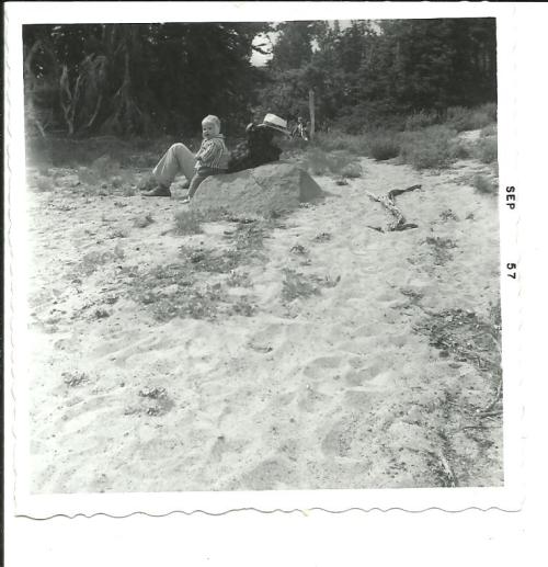My father and I rest on a sandy bank at Bird Creek Meadows in 1957, when I was a year old.