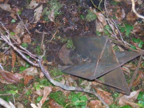 The tail of an unexploded Japanese balloon bomb protrudes above the mossy forest floor near Lumy, British Columbia.